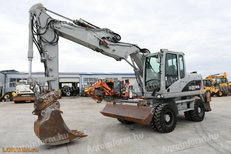 Caterpillar M313D gumikerekes kotró