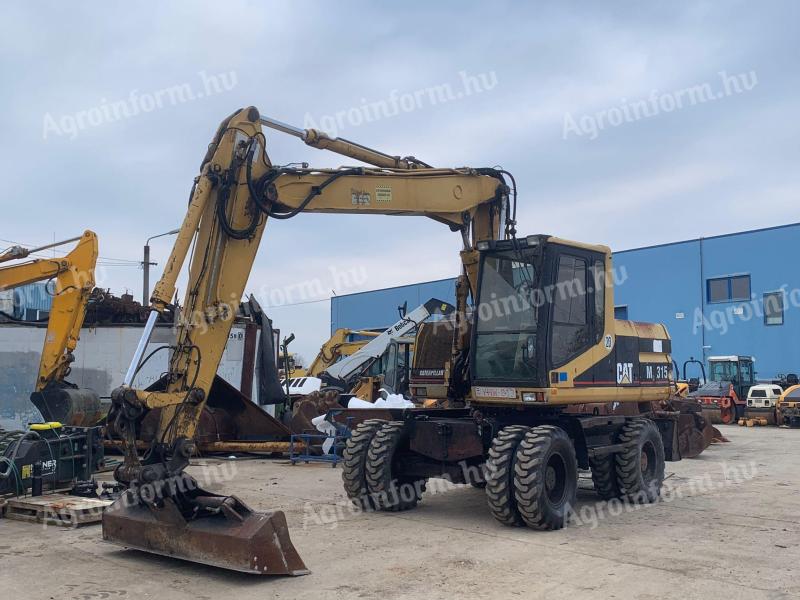 Caterpillar M315 gumikerekes kotró