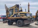 Caterpillar M315 gumikerekes kotró