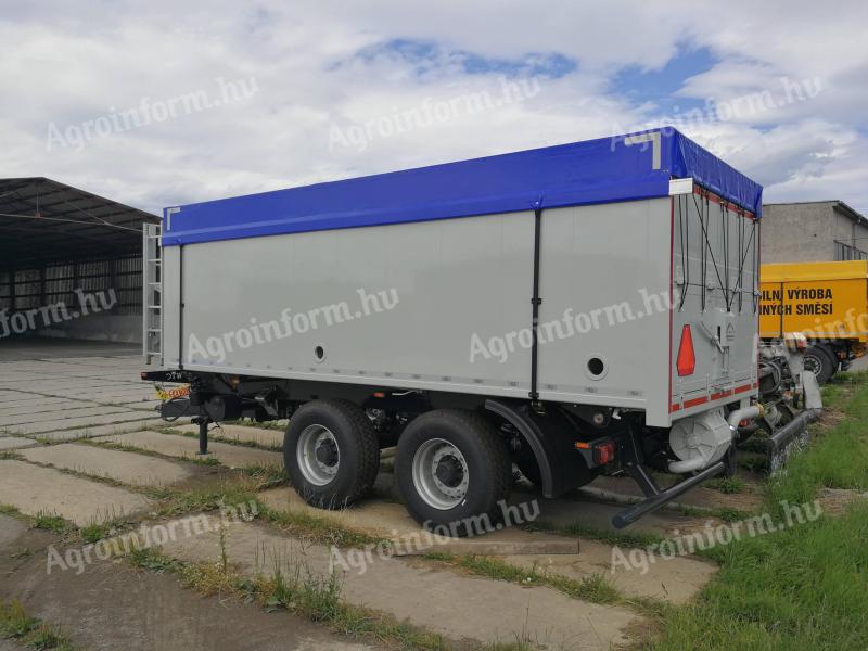 Tipping platform, 2-compartment crop and feed trailer with blower discharge