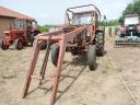 Front loader with bucket and bale spike