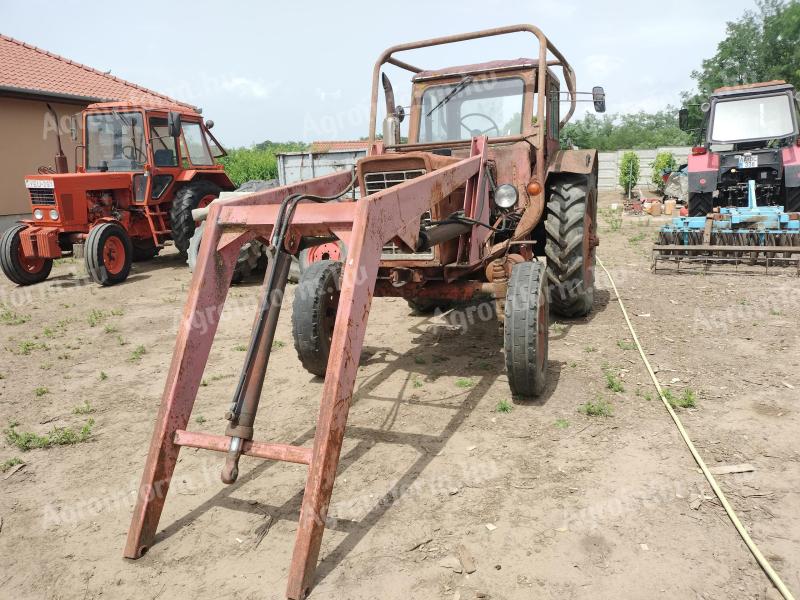 Front loader with bucket and bale spike