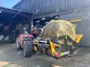 Fixed bale extractor and spreader / STATION-TINE-DOOR