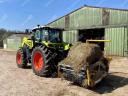 Fixed bale extractor and spreader / STATION-TINE-DOOR