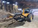 Fixed bale extractor and spreader / STATION-TINE-DOOR