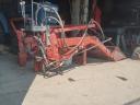 Front loader for mounting on a small tractor