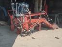 Front loader for mounting on a small tractor