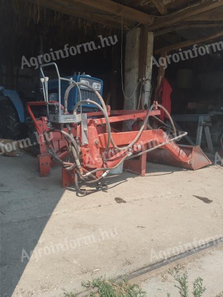 Front loader for mounting on a small tractor