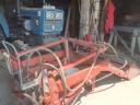 Front loader for mounting on a small tractor