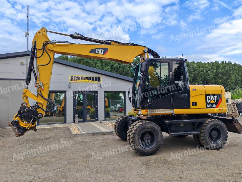 Rotační rýpadlo Caterpillar M313D s gumovými koly