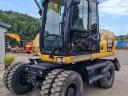 Rotační rýpadlo Caterpillar M313D s gumovými koly