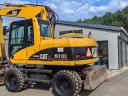 Vrtljivi bager z gumijastimi kolesi Caterpillar M313C