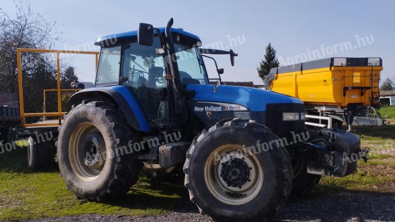 TM 155 New Holland with cultivator wheel set for sale