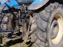 TM 155 New Holland with cultivator wheel set for sale