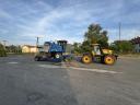 Heavy machinery trailer with low bed, red plates