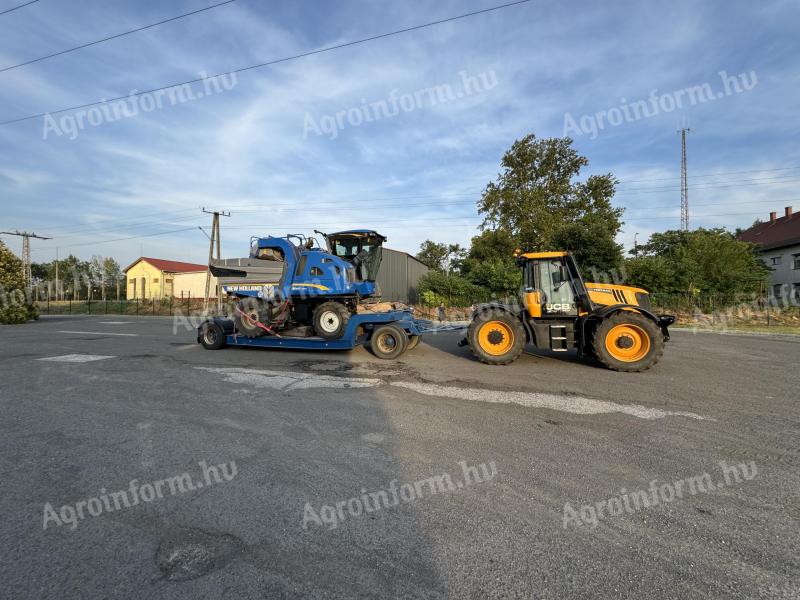 Heavy machinery trailer with low bed, red plates