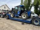 Heavy machinery trailer with low bed, red plates