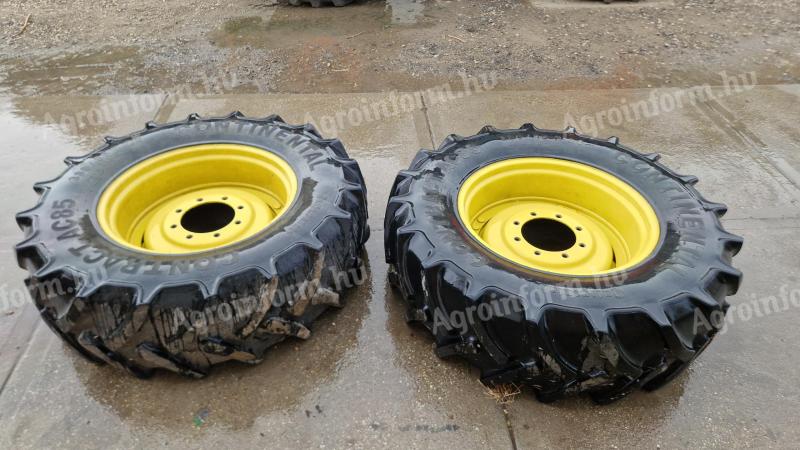 Pair of John Deere wheels (like new rims, with 50% rubber)