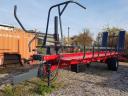 Round bale pick-up and transport trailer