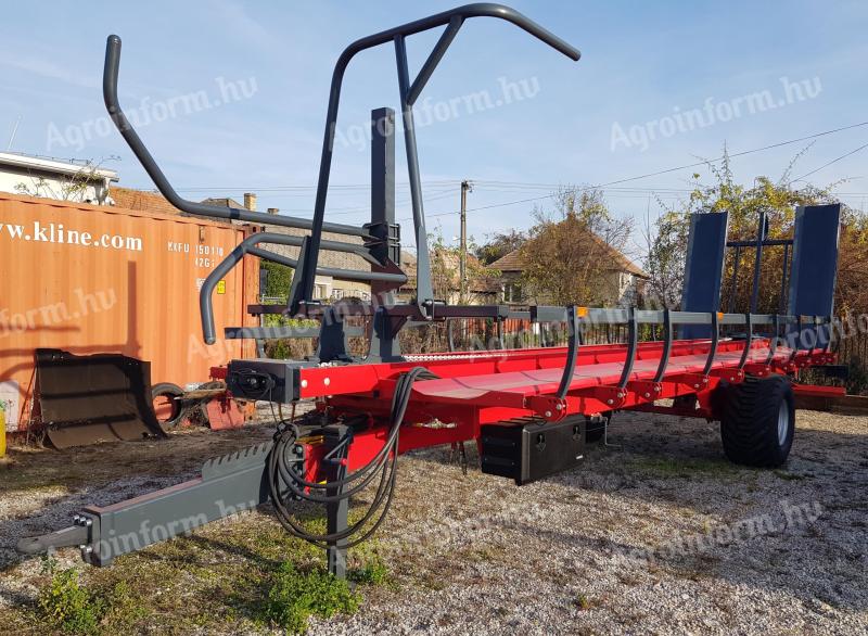 Round bale pick-up and transport trailer