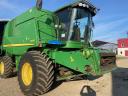 John Deere W650 combine with adapters