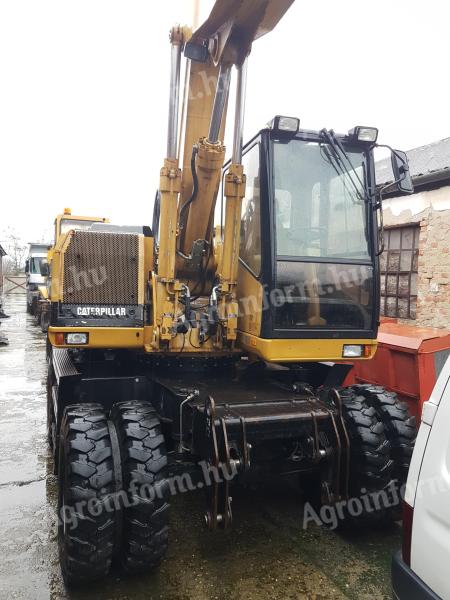 Excavator rotativ cu roți din cauciuc Caterpillar M315