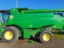 For sale John Deere W540 combine with sunflower and corn adapters