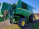 For sale John Deere W540 combine with sunflower and corn adapters