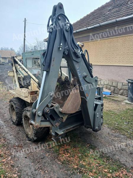 Gehl Bobcet Locust árokaso adapter.