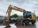 Caterpillar M313D rubber wheel excavator