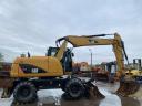 Caterpillar M313D rubber wheel excavator