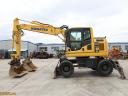 Rypadlo Komatsu PW148-10 s gumovými koly