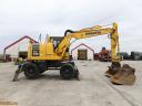 Rypadlo Komatsu PW148-10 s gumovými koly