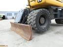Rypadlo Komatsu PW148-10 s gumovými koly