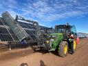 Solar panel cleaning adapter for tractor, wheel loader, skid steer loader, telescopic handler