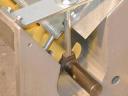 Grain handling with serrated and chain hoist