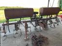 Row cultivator, fertiliser spreader