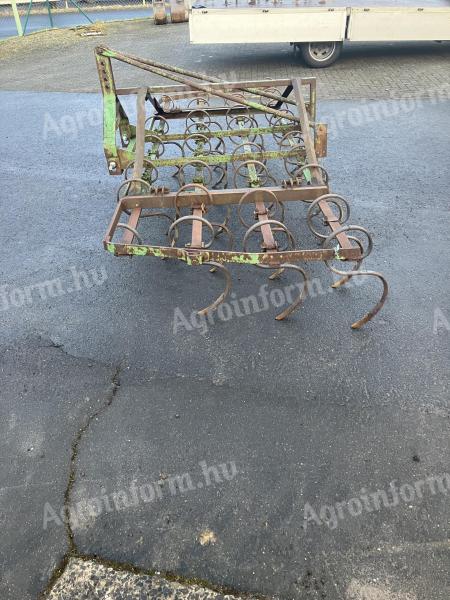 Cultivator with spring tine