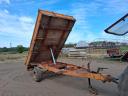 Single-axle tipper trailer with iron sides and platform