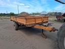 Single-axle tipper trailer with iron sides and platform