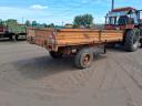 Single-axle tipper trailer with iron sides and platform