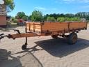 Single-axle tipper trailer with iron sides and platform