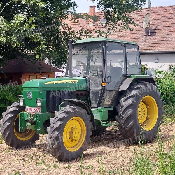 John Deere 2450, 4x4, with single row reel