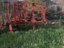 Heavy-duty cultivator, four and a half metres wide, semi-suspended, with a working roller