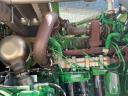 John Deere 8500i with grain spreader, pick-up, corn adapter
