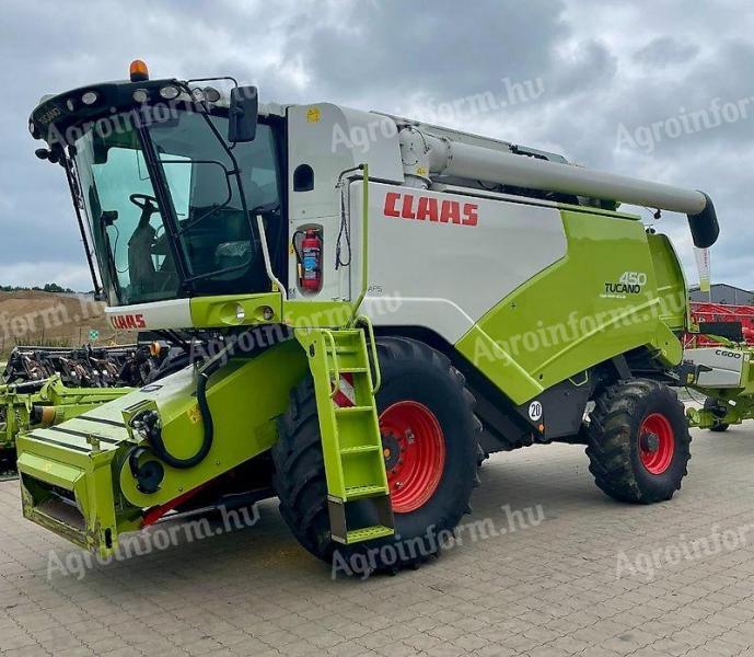 CLAAS TUCANO 450 APS combine harvester with cutting table and transport trolley
