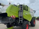 CLAAS TUCANO 450 APS combine harvester with cutting table and transport trolley
