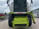 CLAAS TUCANO 450 APS combine harvester with cutting table and transport trolley