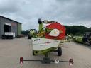CLAAS TUCANO 450 APS combine harvester with cutting table and transport trolley