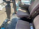 John Deere W650 combine harvester with grain table, with transport wagon